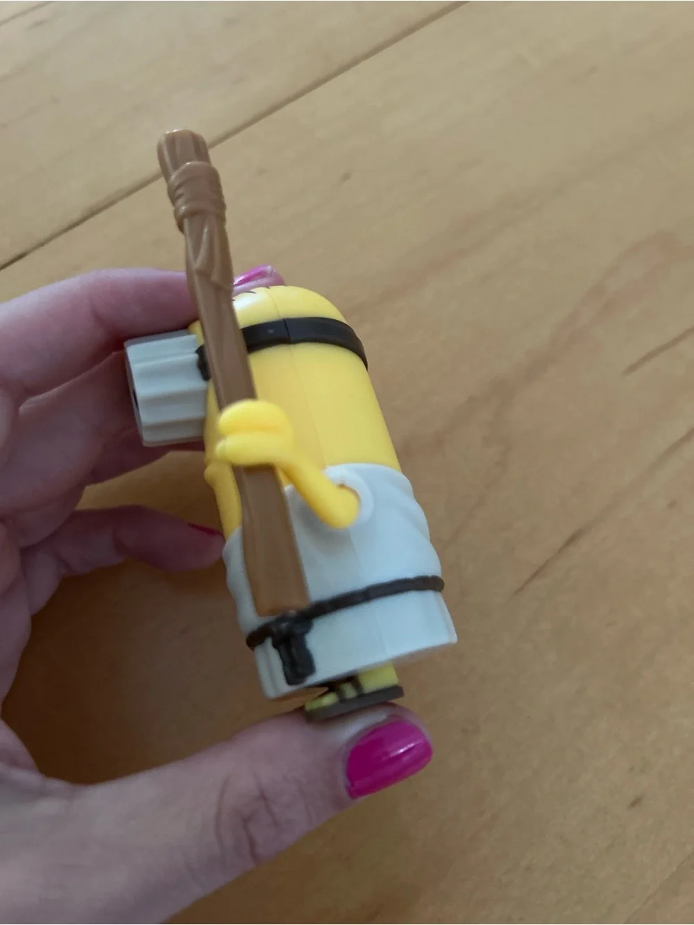 One-Eyed Yellow Action Figure with Brown Staff - Classic Cartoon Style